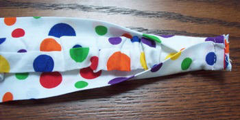 Stitch some elastic into your headband to keep it in place when you wear it.